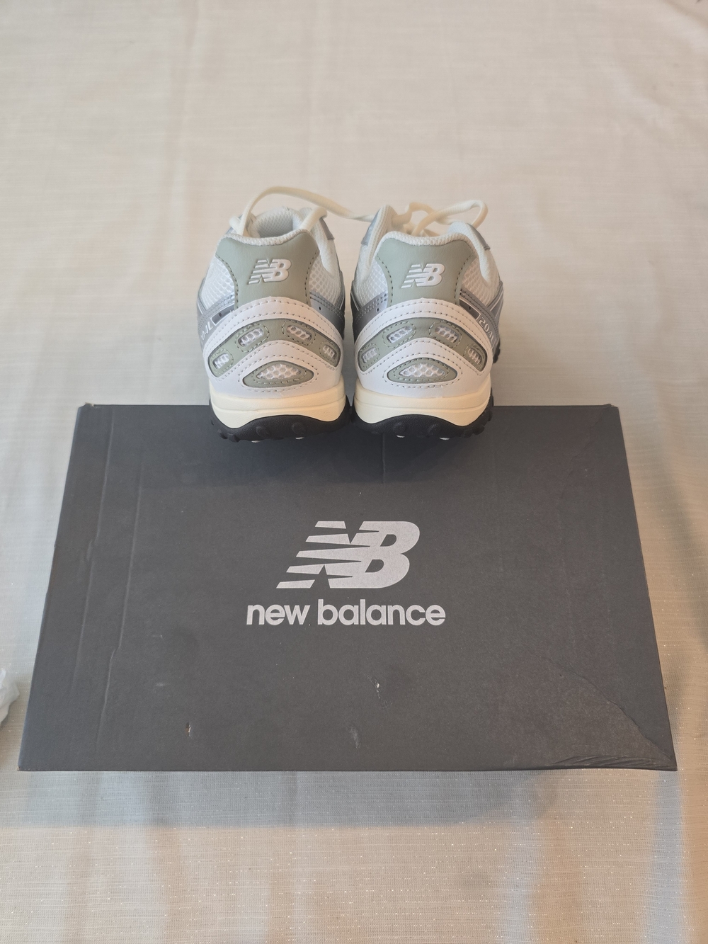 New Balance 204L sneakers in a clean White/Light Gray colorway. - Picture 4 of 5